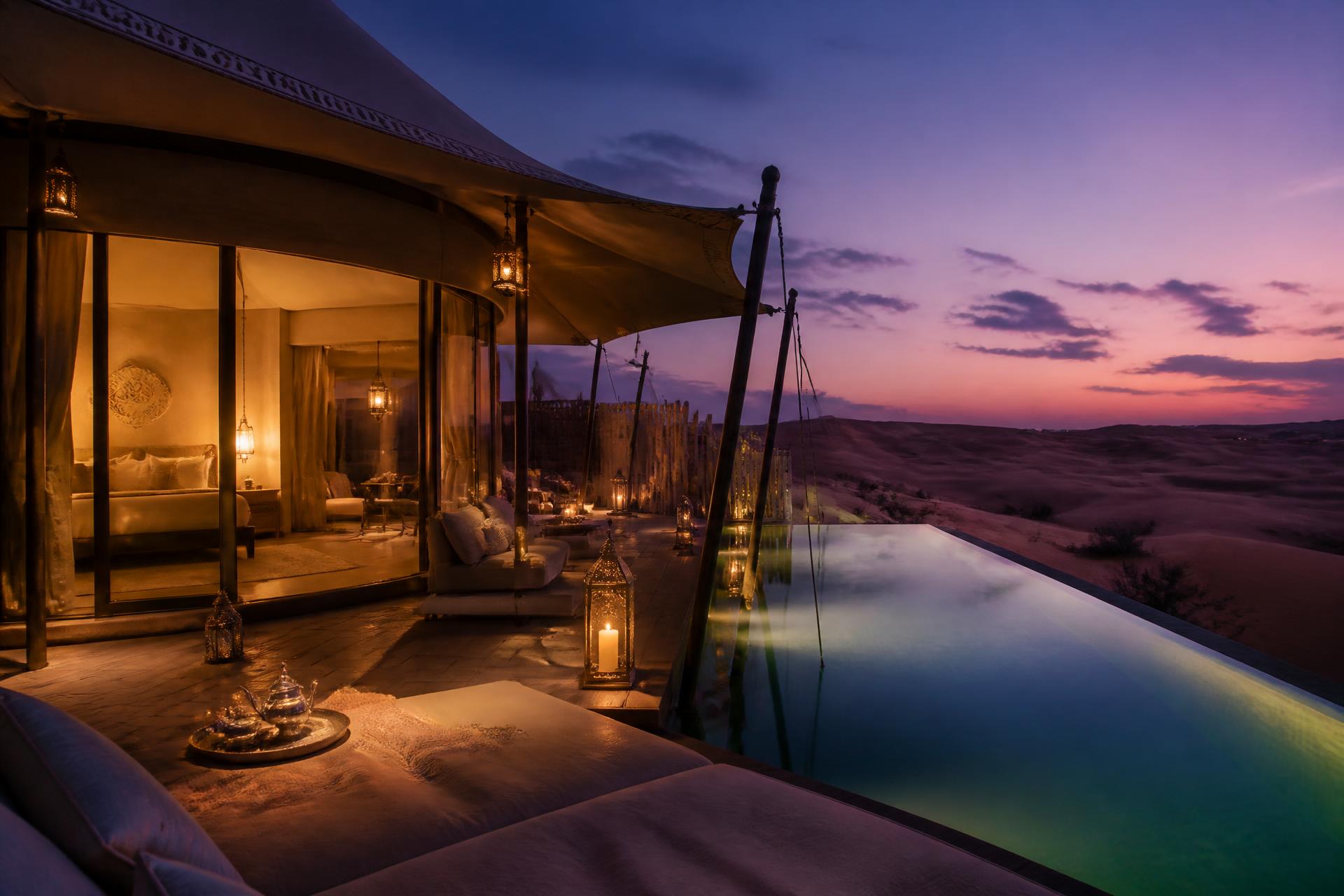 Luxurious off-grid tented eco-resort suite in the Dubai desert at twilight